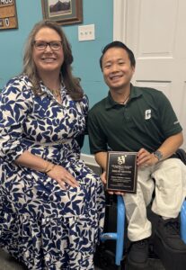 ZhiLei Moyer receiving his award from Kim Eroh with ECAC
