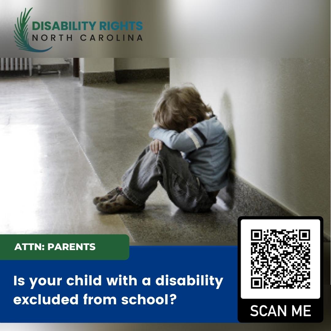 image of child seated alone on floor of school hallway with head down