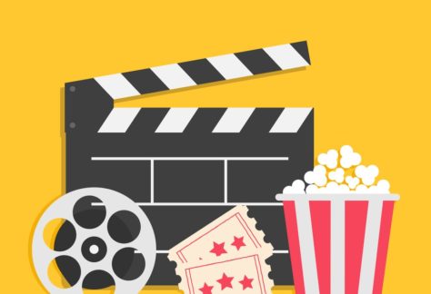 Image of a clapperboard, video reel, movie tickets and popcorn with text that reads New Release!