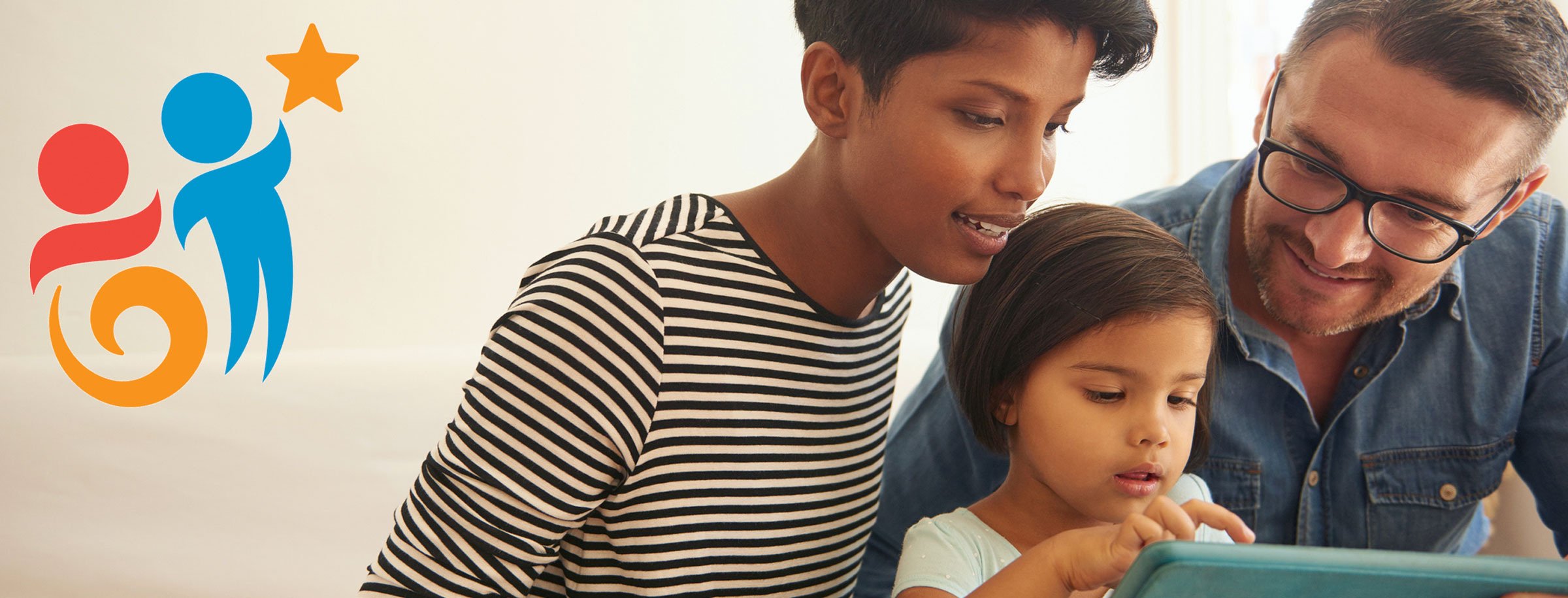 parents with child on tablet device